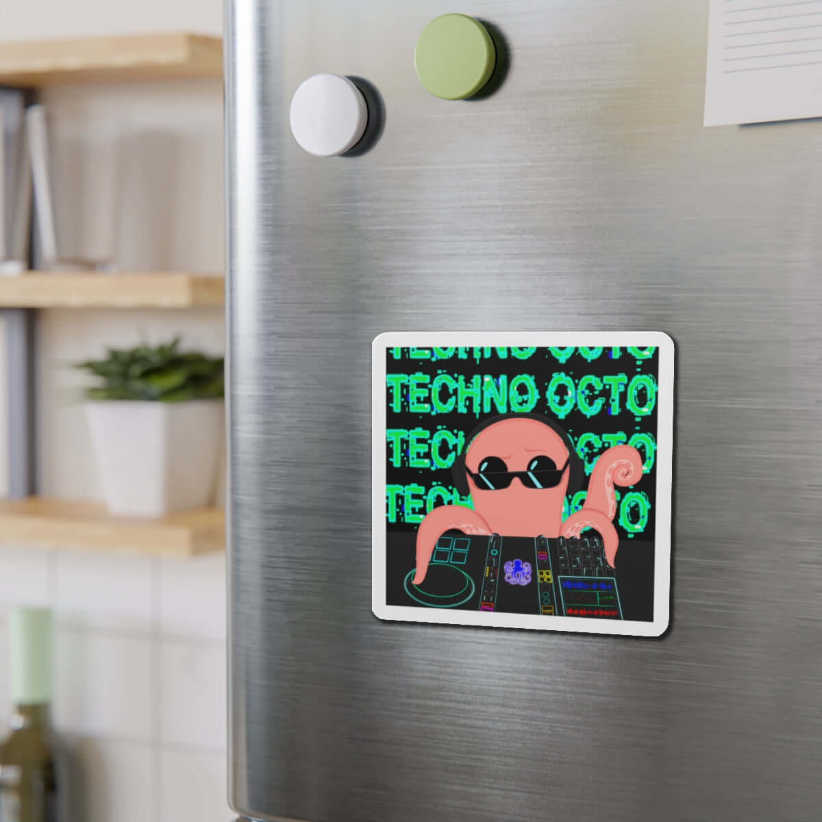 Techno Octo die-cut magnet on fridge, featuring an octopus with sunglasses and music graphics, promoting Octopus Revolution.