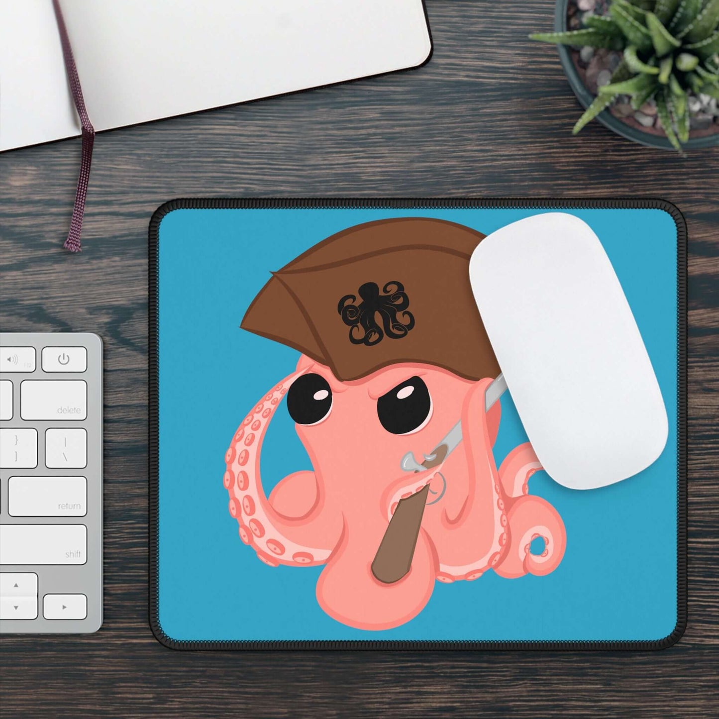Original Octopus Revolution mascot mousepad featuring a cartoon octopus in a pirate hat with a gaming mouse on it.