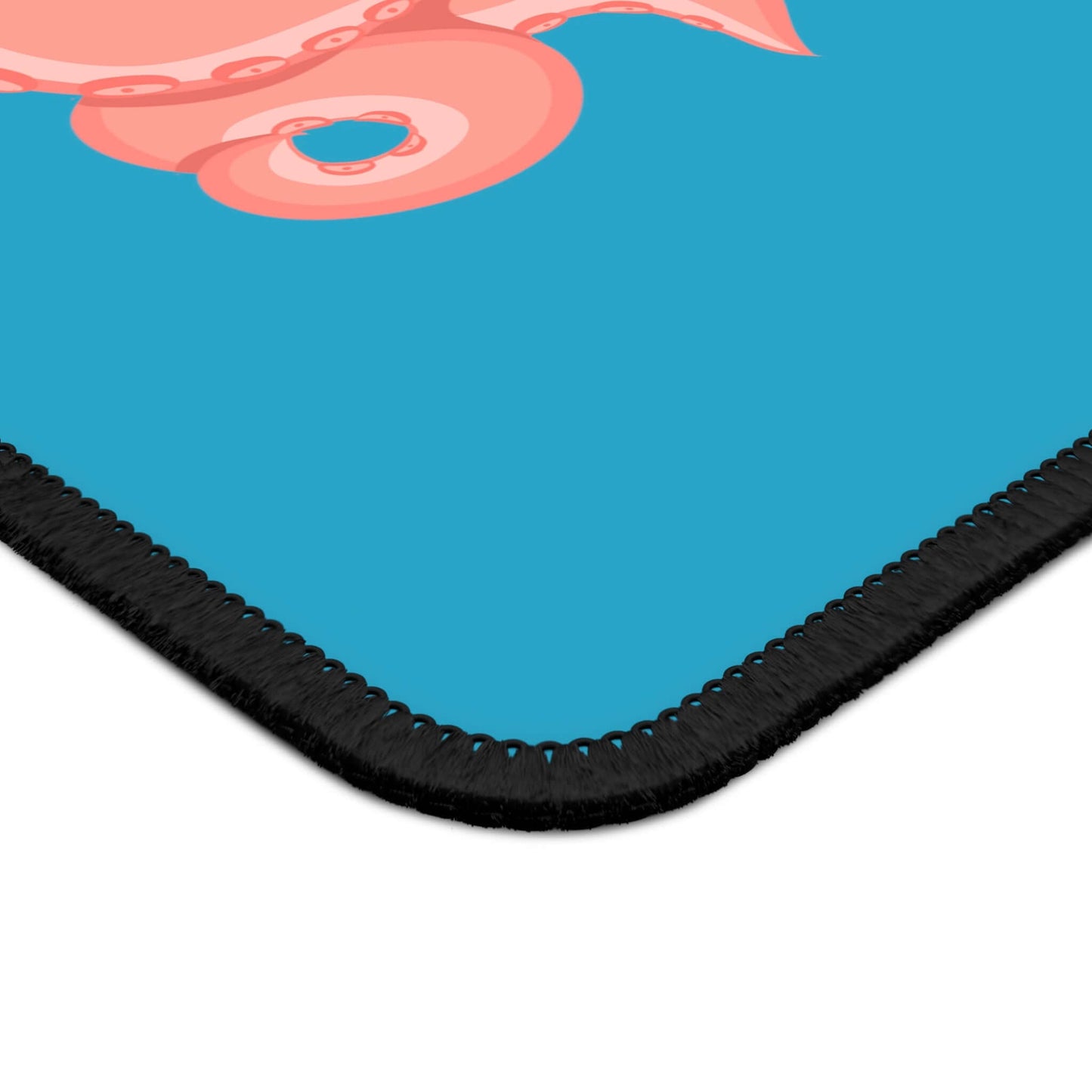 Close-up of the Original Octopus Revolution mascot mousepad featuring vibrant octopus design on a blue background.